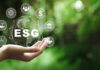 ESG icon concept in the hand for environmental, social, and governance in sustainable and ethical business on the Network connection on a green background.