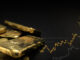 Symbobild für Gold: Goldbaren und ein steigender Kurs