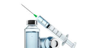 Spritze und Medizinfläschchen als Symbolbild für Healthcare