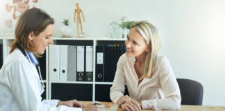 Shot of a female doctor discussing something with her patient
