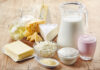 Various fresh dairy products on wooden background