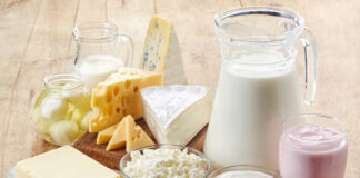 Various fresh dairy products on wooden background