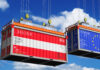 OeKB: Exporteure nutzen Absicherungen Shipping containers with flags of Austria and European Union - 3D illustration