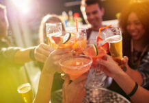 Shot of a group of people toasting with their drinks at a nightclub 615833974 Buddy, Beautiful, Clubbing, African Descent, Real People, Candid, Social Gathering, Young Women, Women, Females, Group Of People, Copy Space, Weekend Activities, Breaking the Ice, Celebration, Lens Flare, Nightclub, Music, Drinking Glass, 20-29 Years, Young Adult, Adult, Smiling, Looking, Drinking, Disco Dancing, Holding, Fun, Beauty, African Ethnicity, Multi-Ethnic Group, Ethnic, Ethnicity, Bonding, Togetherness, Carefree, Enjoyment, Happiness, Friendship, Dark, Food And Drink, Indoors, Close-up, Cheerful, Positive Emotion, Heterosexual Couple, People, Night, New Year's Eve, Celebratory Toast, Party - Social Event, Celebration Event, Cocktail, Alcohol, Drink, Attractive Female, Holidays And Celebrations