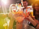 Shot of a group of people toasting with their drinks at a nightclub 615833974 Buddy, Beautiful, Clubbing, African Descent, Real People, Candid, Social Gathering, Young Women, Women, Females, Group Of People, Copy Space, Weekend Activities, Breaking the Ice, Celebration, Lens Flare, Nightclub, Music, Drinking Glass, 20-29 Years, Young Adult, Adult, Smiling, Looking, Drinking, Disco Dancing, Holding, Fun, Beauty, African Ethnicity, Multi-Ethnic Group, Ethnic, Ethnicity, Bonding, Togetherness, Carefree, Enjoyment, Happiness, Friendship, Dark, Food And Drink, Indoors, Close-up, Cheerful, Positive Emotion, Heterosexual Couple, People, Night, New Year's Eve, Celebratory Toast, Party - Social Event, Celebration Event, Cocktail, Alcohol, Drink, Attractive Female, Holidays And Celebrations
